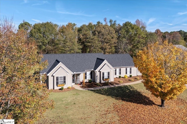 ranch-style house featuring a front lawn