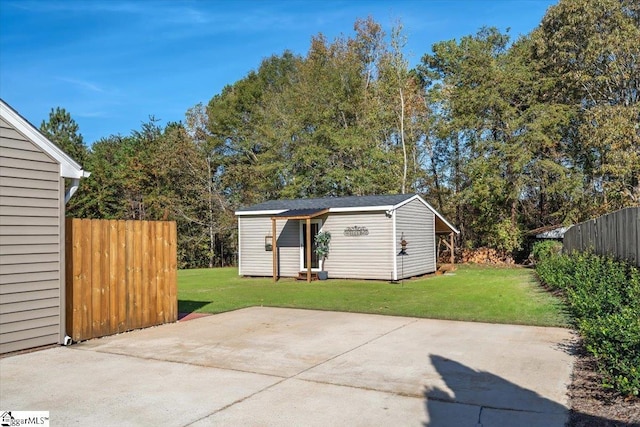 view of outdoor structure featuring a lawn