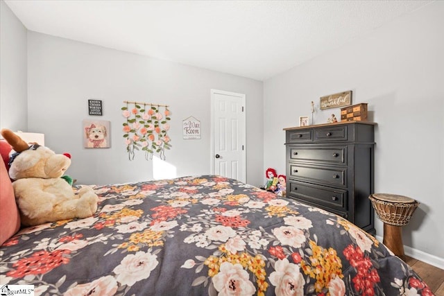 bedroom featuring wood-type flooring