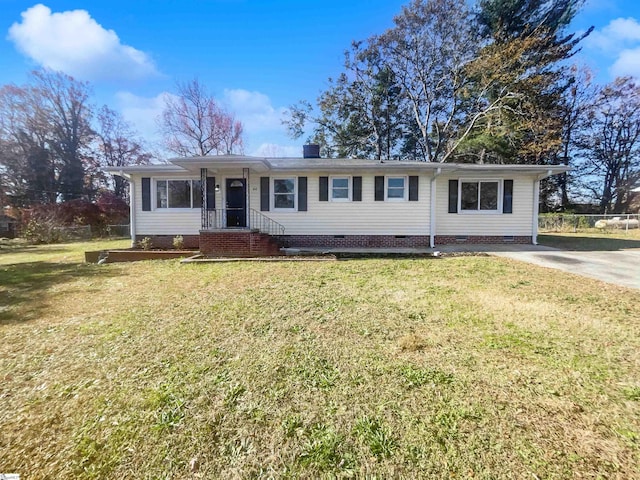 ranch-style home with a front yard