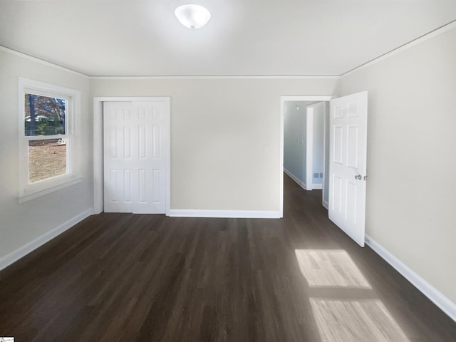 empty room with dark hardwood / wood-style floors