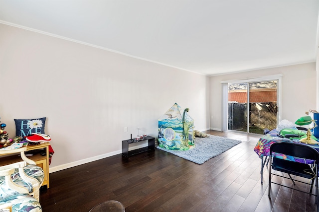 interior space with dark hardwood / wood-style flooring and ornamental molding