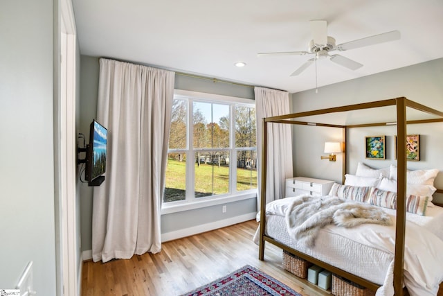 bedroom featuring light hardwood / wood-style floors and ceiling fan