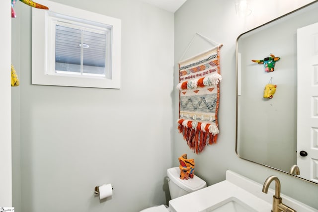 bathroom with toilet and sink