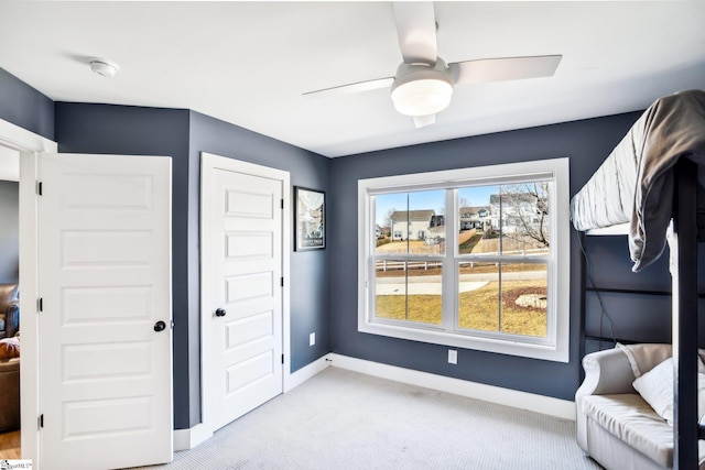 bedroom with light carpet and ceiling fan