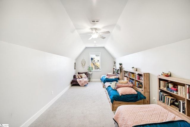 interior space featuring carpet flooring, vaulted ceiling, and ceiling fan