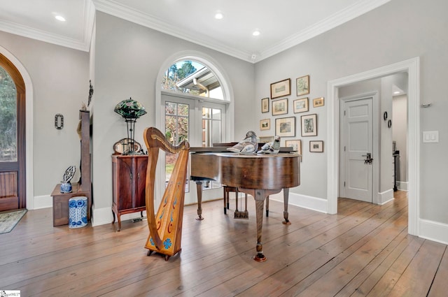 foyer entrance with french doors, light hardwood / wood-style flooring, and ornamental molding