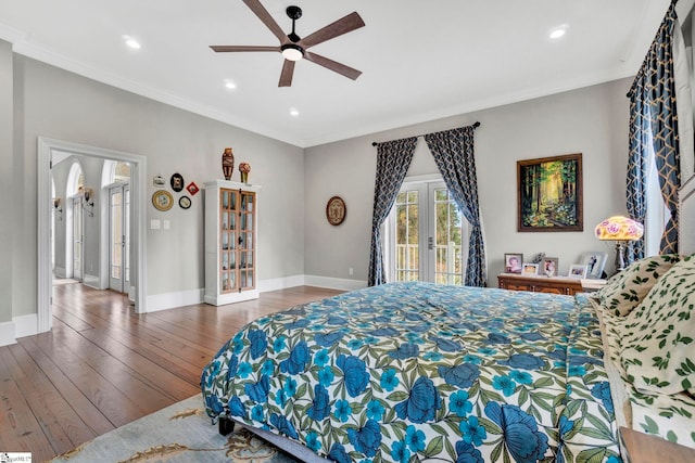 bedroom featuring ceiling fan, dark hardwood / wood-style floors, access to exterior, and crown molding