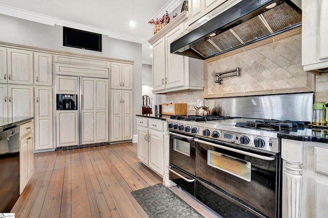 kitchen featuring light wood-type flooring, backsplash, ventilation hood, high end appliances, and crown molding