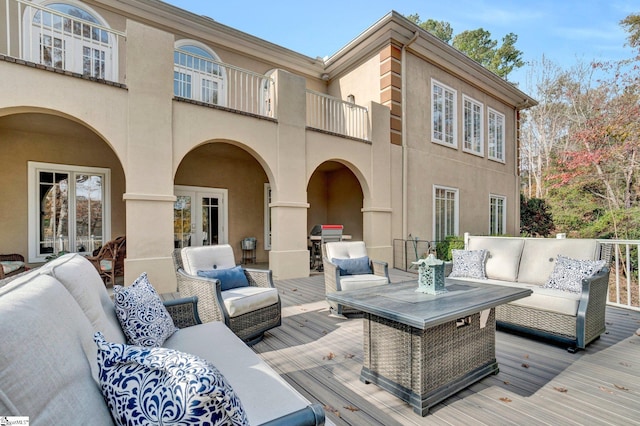 deck featuring french doors and an outdoor living space