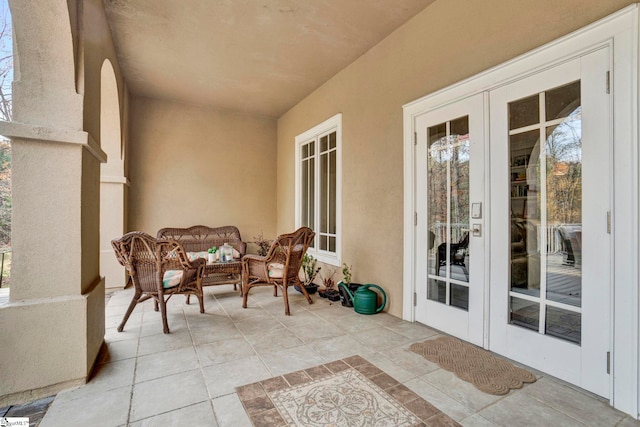 view of patio with outdoor lounge area and french doors