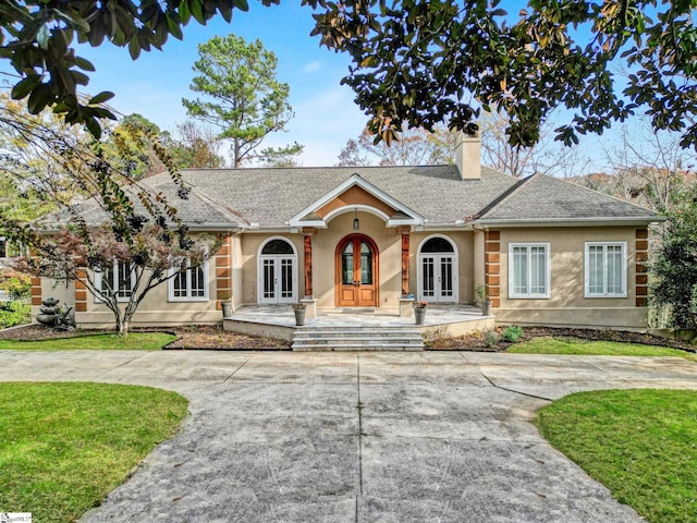 single story home featuring french doors