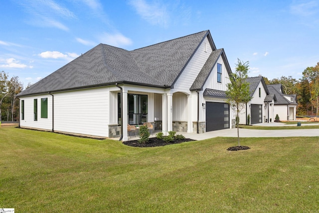 view of side of home featuring a yard and a garage