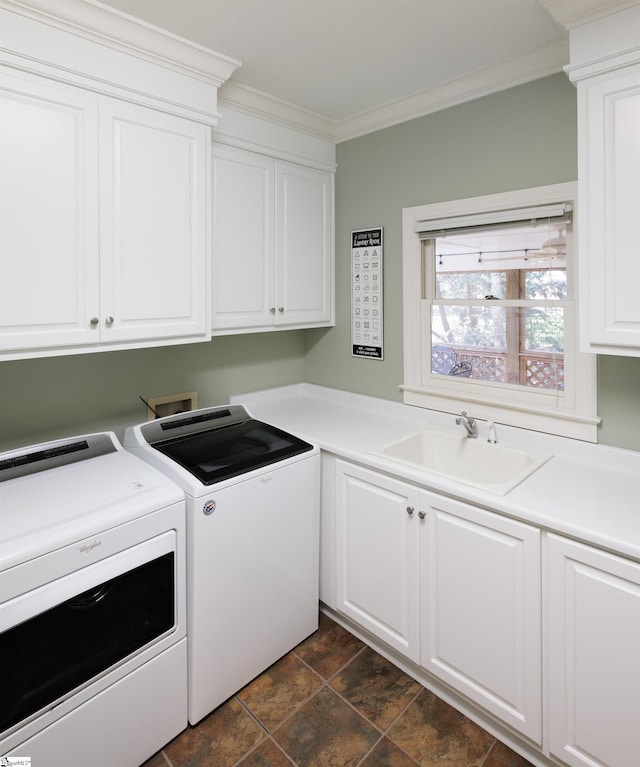 washroom with washer and clothes dryer, cabinets, ornamental molding, and sink