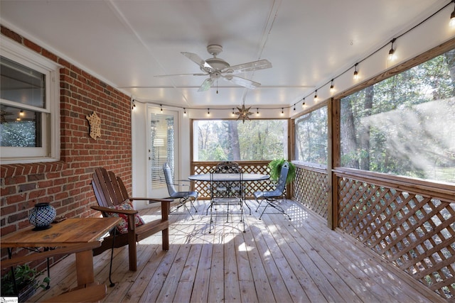 wooden deck featuring ceiling fan