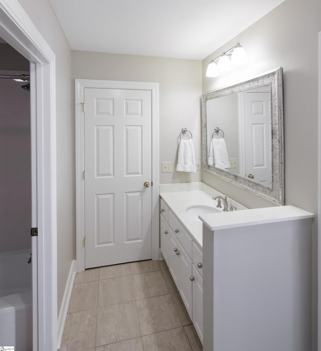 bathroom with tile patterned flooring and vanity