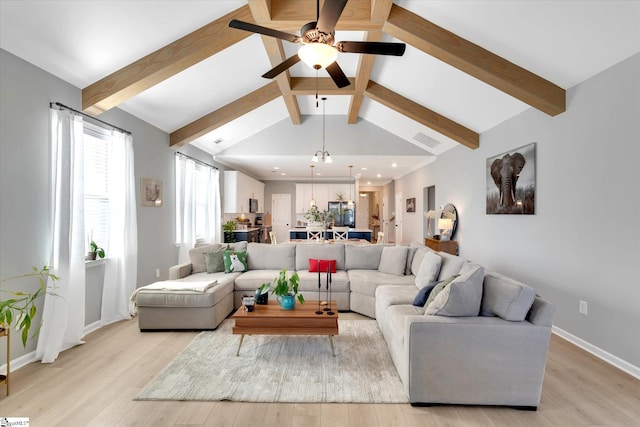 living room featuring vaulted ceiling with beams, ceiling fan, and light hardwood / wood-style flooring