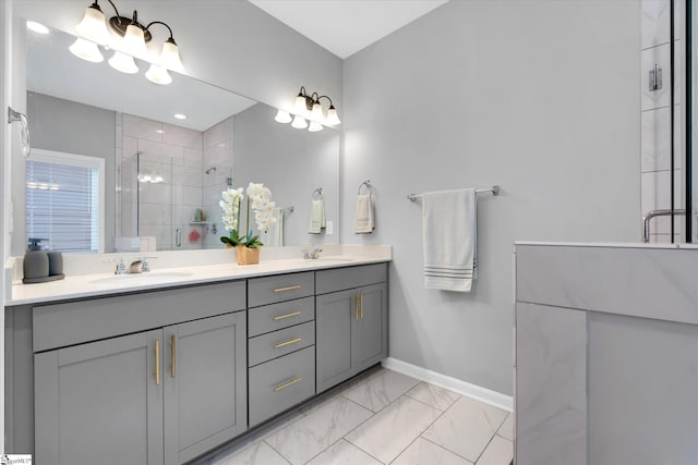 bathroom with vanity and a shower with shower door