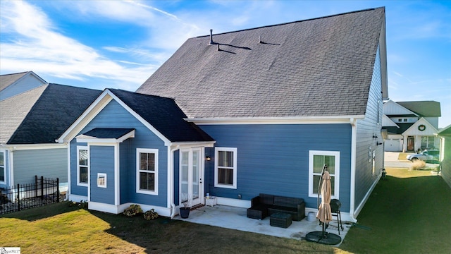 rear view of house featuring a yard