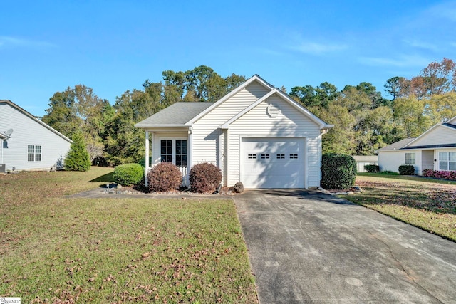 view of front of house featuring a garage and a front yard