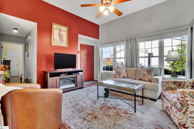 living room with a wealth of natural light and ceiling fan