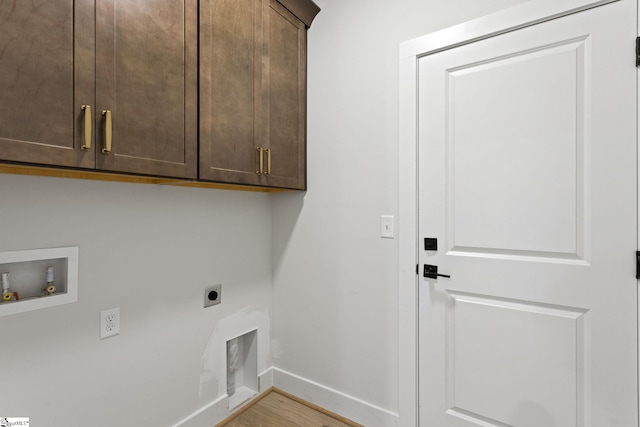 laundry area with cabinets, washer hookup, light wood-type flooring, and electric dryer hookup