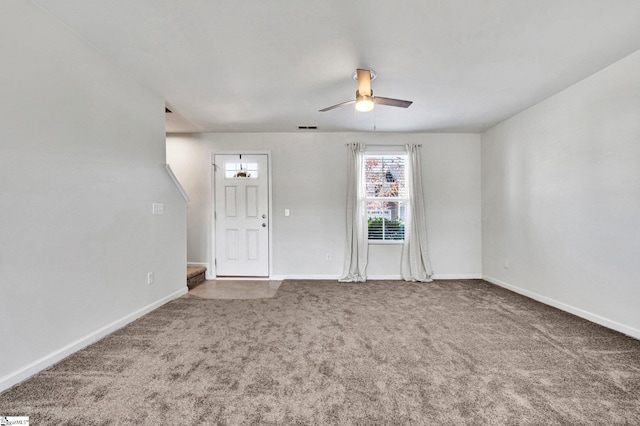 spare room with carpet flooring and ceiling fan