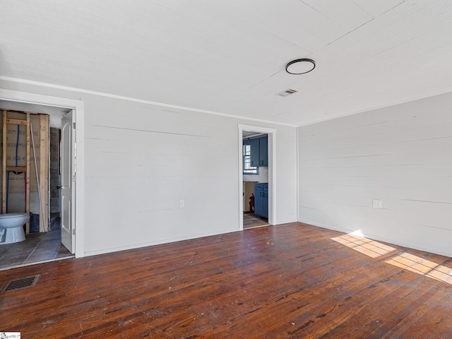 empty room featuring dark hardwood / wood-style floors