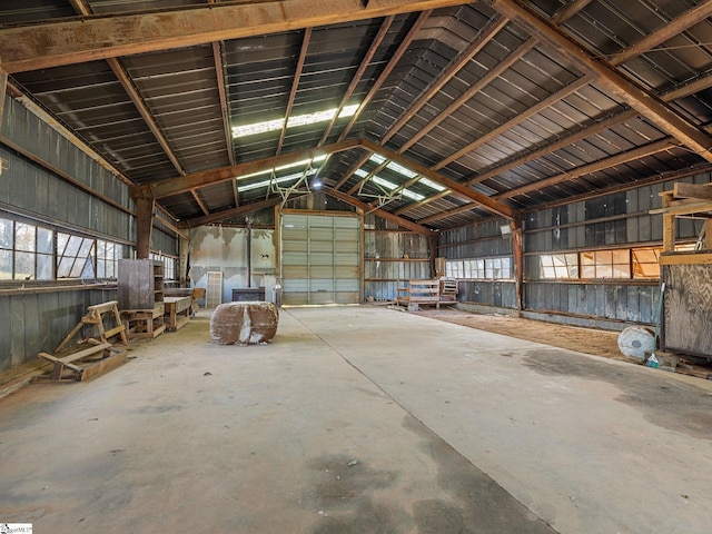 misc room featuring concrete floors and vaulted ceiling