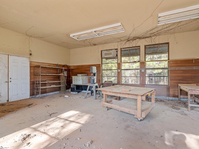 miscellaneous room with concrete floors and an AC wall unit