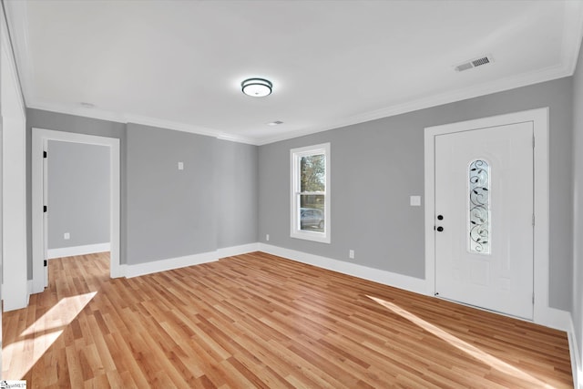 entrance foyer featuring light wood-type flooring and ornamental molding