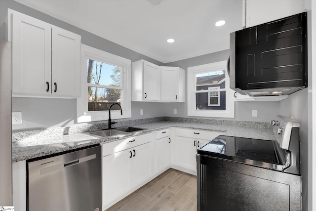 kitchen featuring sink, stainless steel dishwasher, light stone countertops, light hardwood / wood-style floors, and white cabinetry