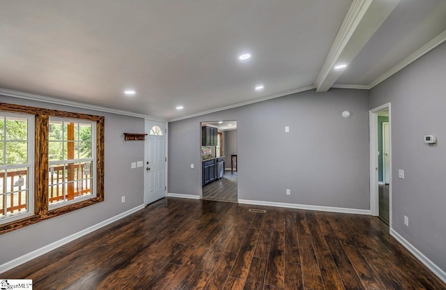 unfurnished room featuring ornamental molding, vaulted ceiling with beams, and dark wood-type flooring