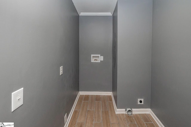 washroom with hookup for a washing machine, light hardwood / wood-style floors, crown molding, and electric dryer hookup