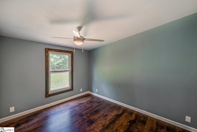 spare room featuring ceiling fan and dark hardwood / wood-style flooring