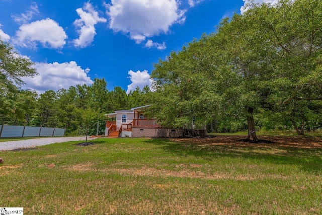 view of yard with a wooden deck