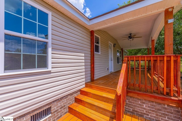 wooden deck with ceiling fan