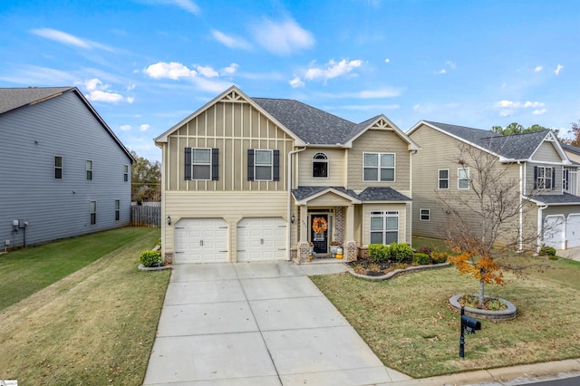 view of front of property featuring a front lawn and a garage