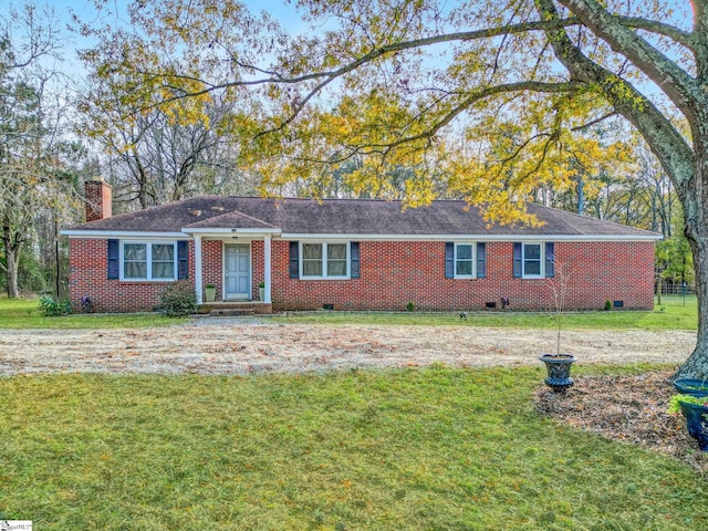 ranch-style home featuring a front yard