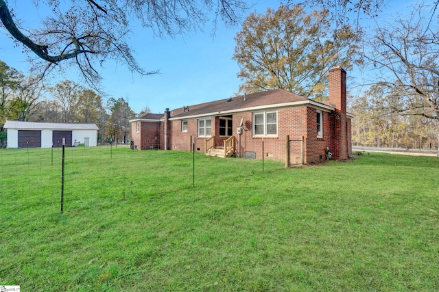 rear view of house featuring a lawn