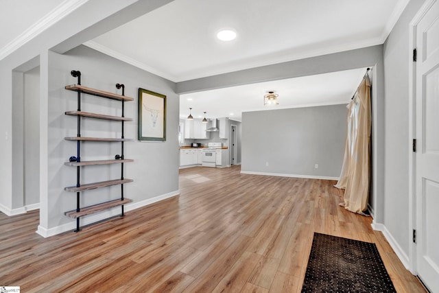 unfurnished living room featuring crown molding and light wood-type flooring