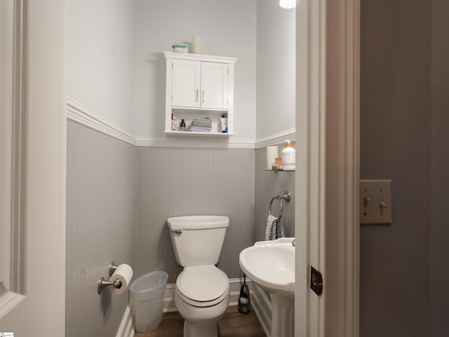 bathroom with sink, wood-type flooring, and toilet