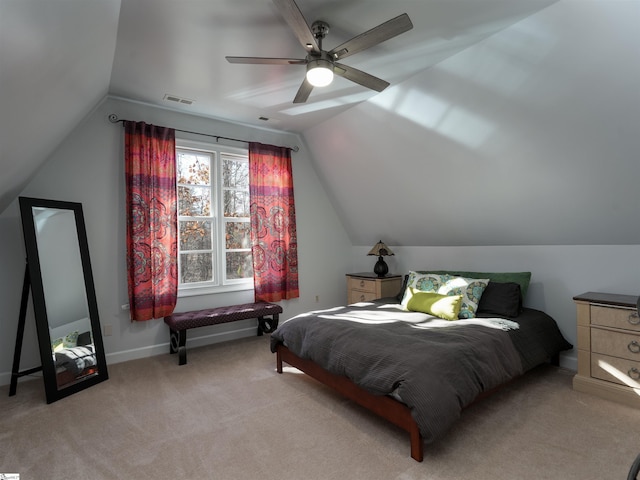 bedroom with ceiling fan, light colored carpet, and lofted ceiling