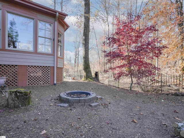 view of yard with an outdoor fire pit