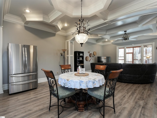 dining room featuring ceiling fan with notable chandelier, wood-type flooring, crown molding, and coffered ceiling