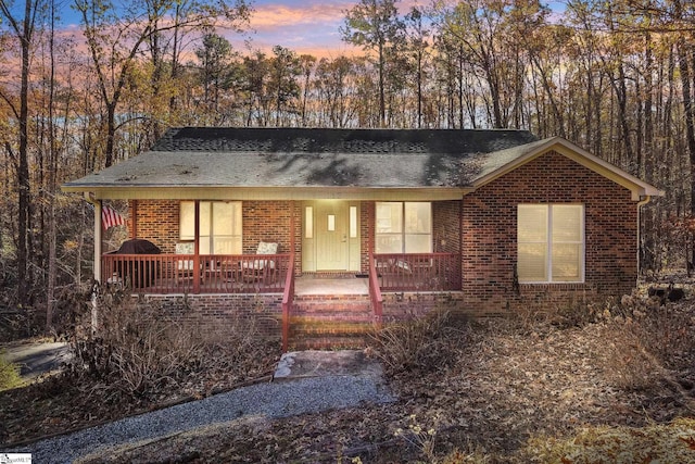 ranch-style home with a porch