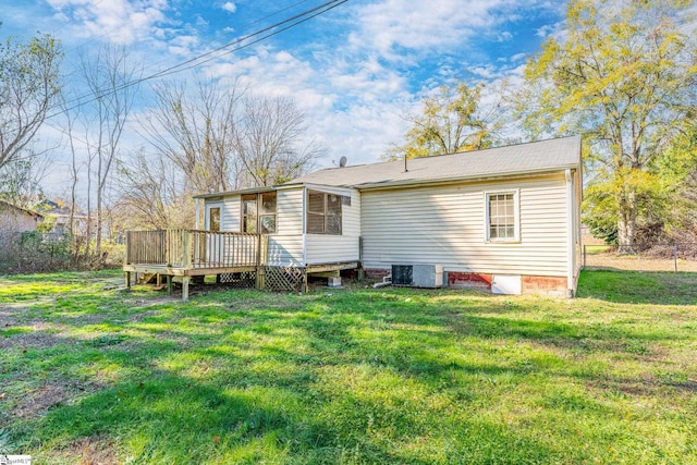 back of house featuring a yard, cooling unit, and a deck