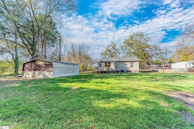 view of yard featuring a wooden deck