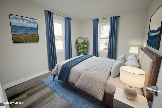 bedroom featuring dark hardwood / wood-style flooring