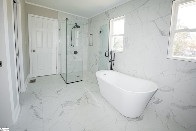 bathroom with a wealth of natural light, crown molding, and shower with separate bathtub